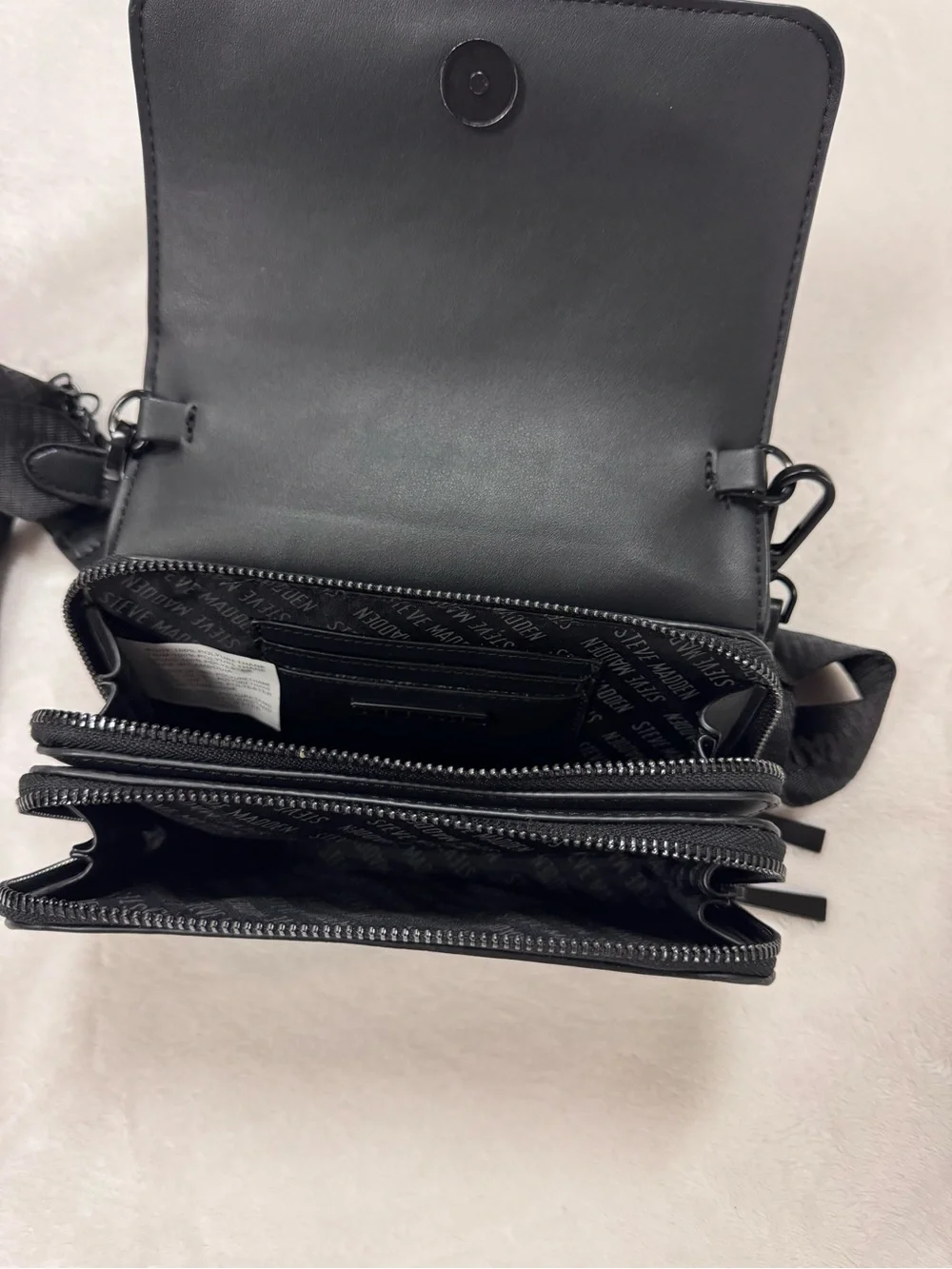Steve Madden Black Embossed Logo Crossbody Bag.